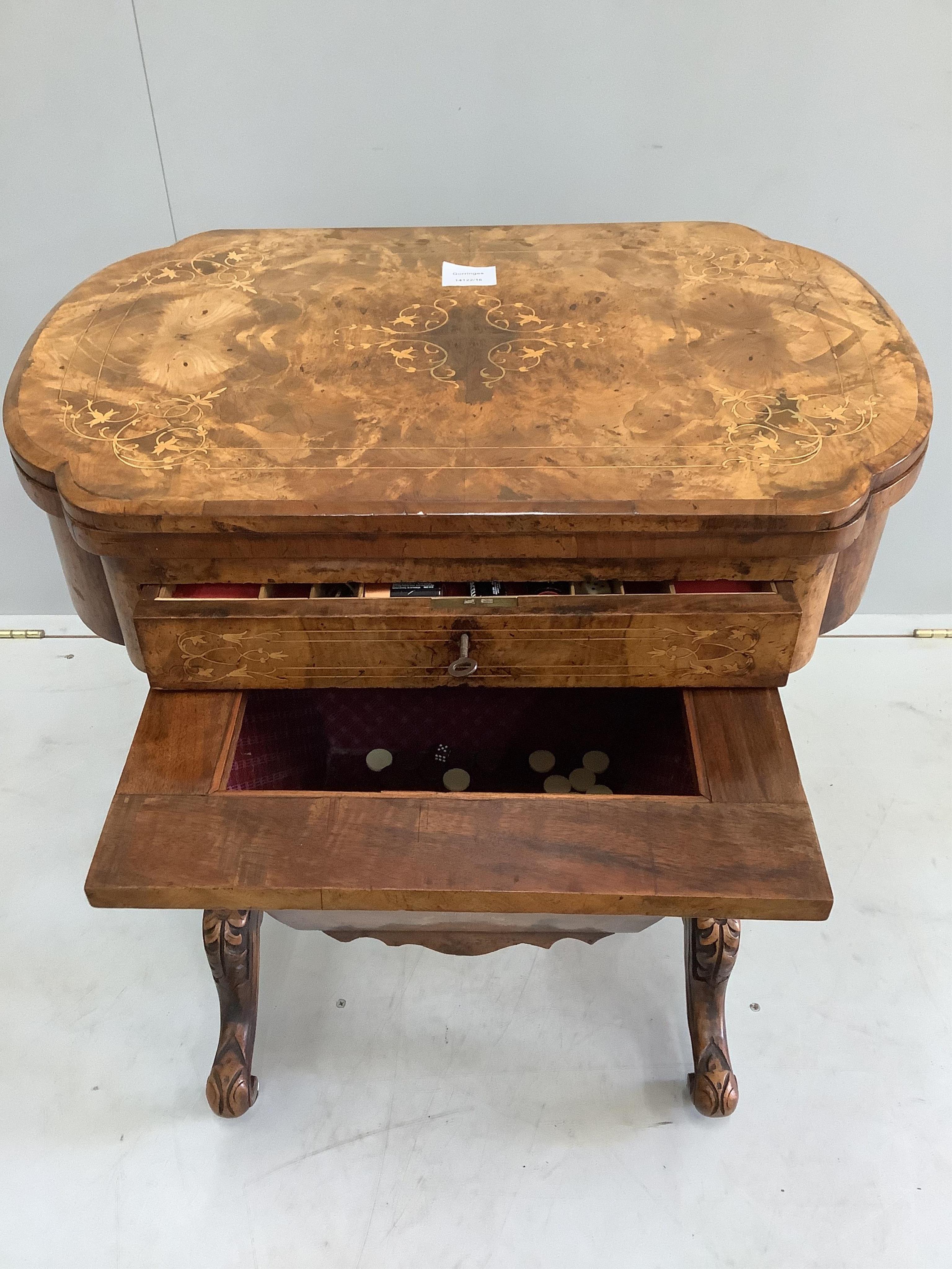 A Victorian marquetry inlaid walnut games / work table, width 61cm, depth 40cm, height 73cm